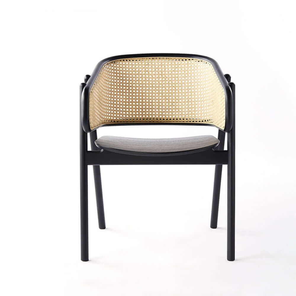 Sleek black rattan chair with modern curved back