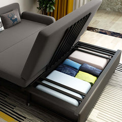 Contemporary deep gray upholstered sofa bed with storage space for modern living room decor