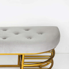 Gray upholstered bench with shelf and gold accents, perfect for adding a touch of elegance to your entryway