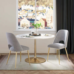 Trendy modern dining chairs in black upholstery with hollow back and elegant gold legs