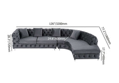 LShaped curved gray velvet sectional sofa with elegant chesterfield design