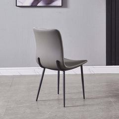 Contemporary gray dining chair with high back, faux leather, and armless design