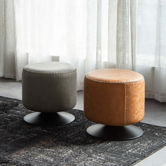 Round cushioned vanity stool with swivel base, perfect for modern bedroom vanities