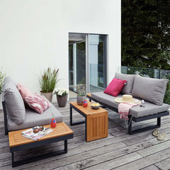 Sectional outdoor furniture set with cushioned back and side table for relaxation