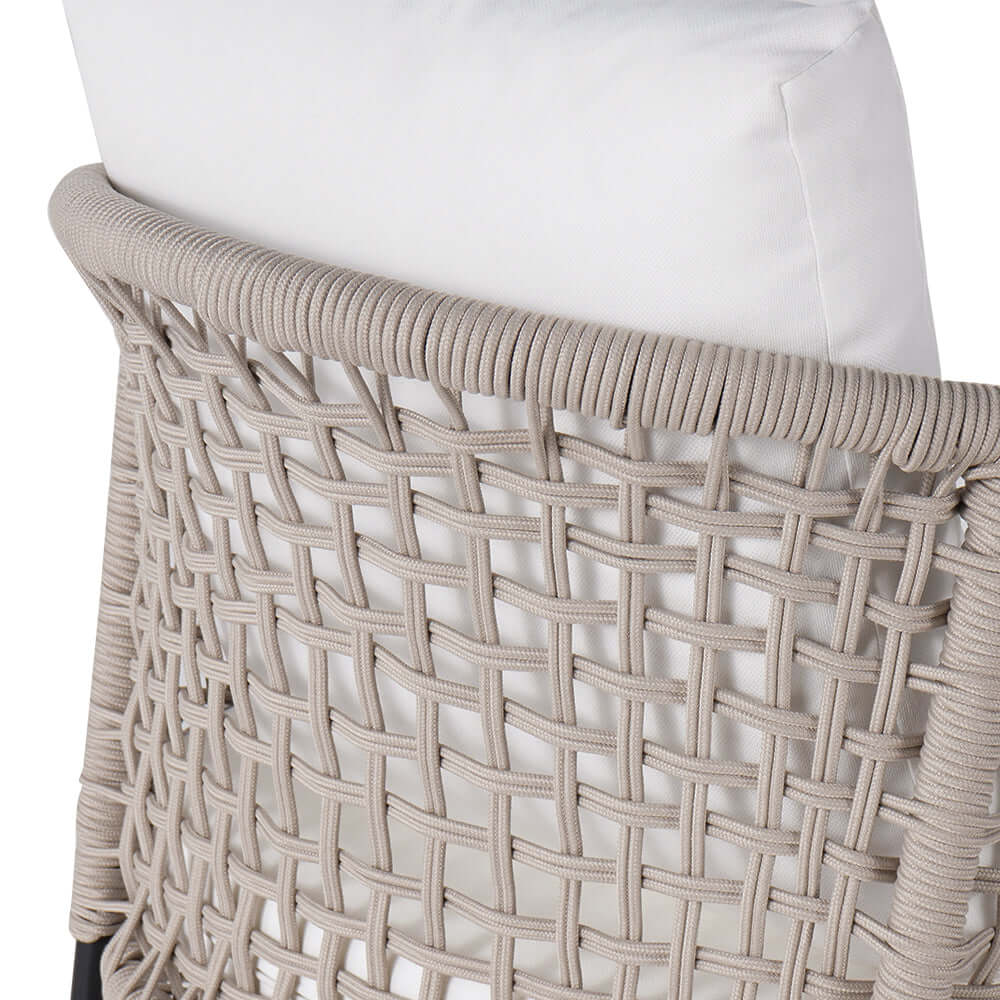 Modern outdoor sofa with ottoman in white and black color scheme