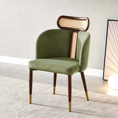 Modern green velvet dining chair with curved back design for comfortable seating