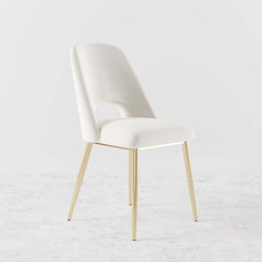 Trendy modern dining chairs in black upholstery with hollow back and elegant gold legs