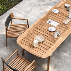 Teak wood table and chair in natural setting for 7 Pieces Modern Outdoor Dining Set