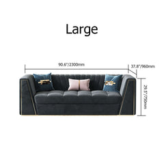 Modular velvet sofa with deep gray tufted upholstery