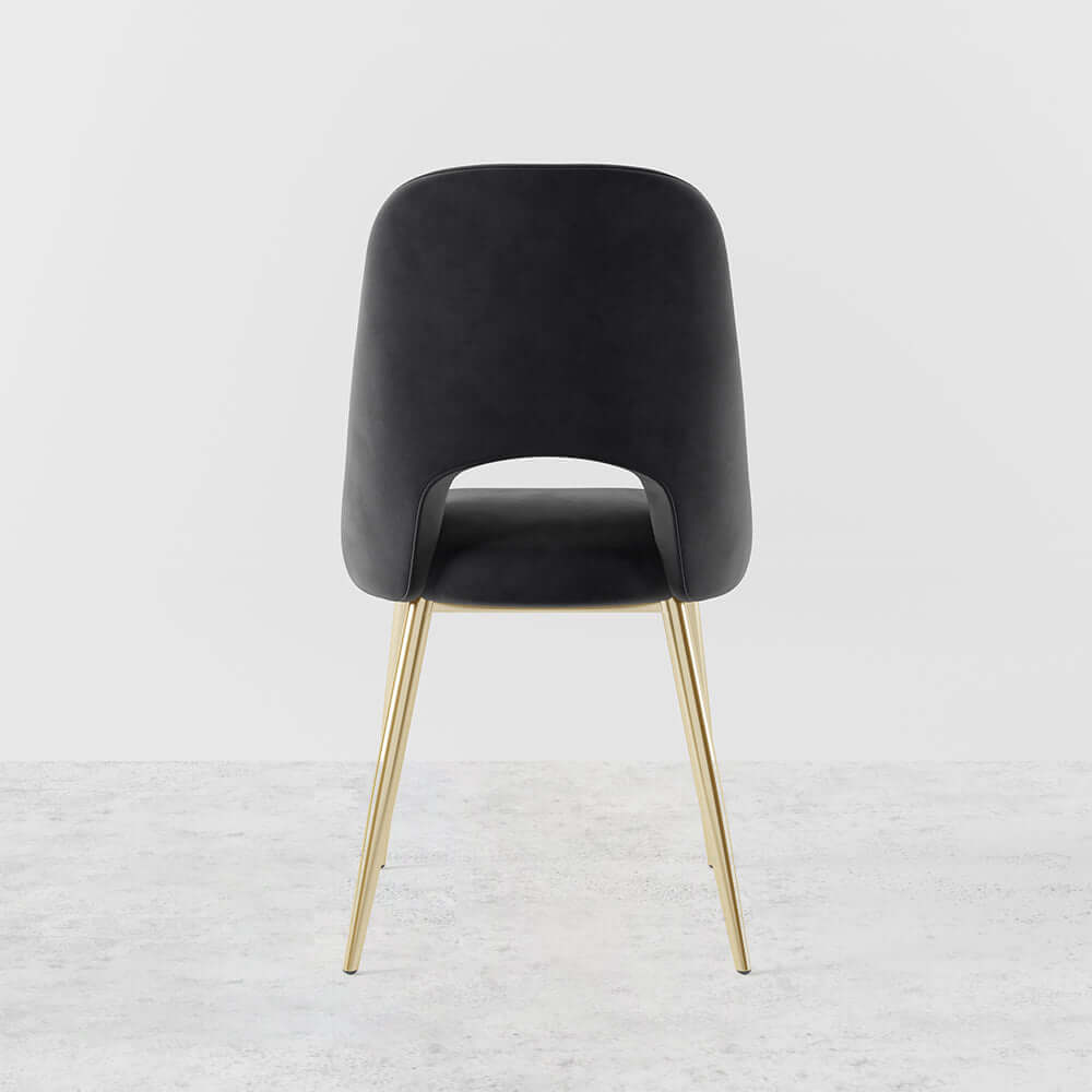 Trendy modern dining chairs in black upholstery with hollow back and elegant gold legs