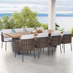 Outdoor dining set with rectangular teak table and comfortable rattan chairs for 8 people