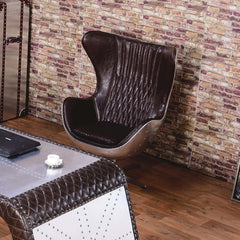 Brown & silver leather desk chair with swivel and wing back, providing support and comfort for long hours