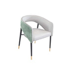 Green velvet upholstered accent chair with sleek metal legs, modern and sophisticated