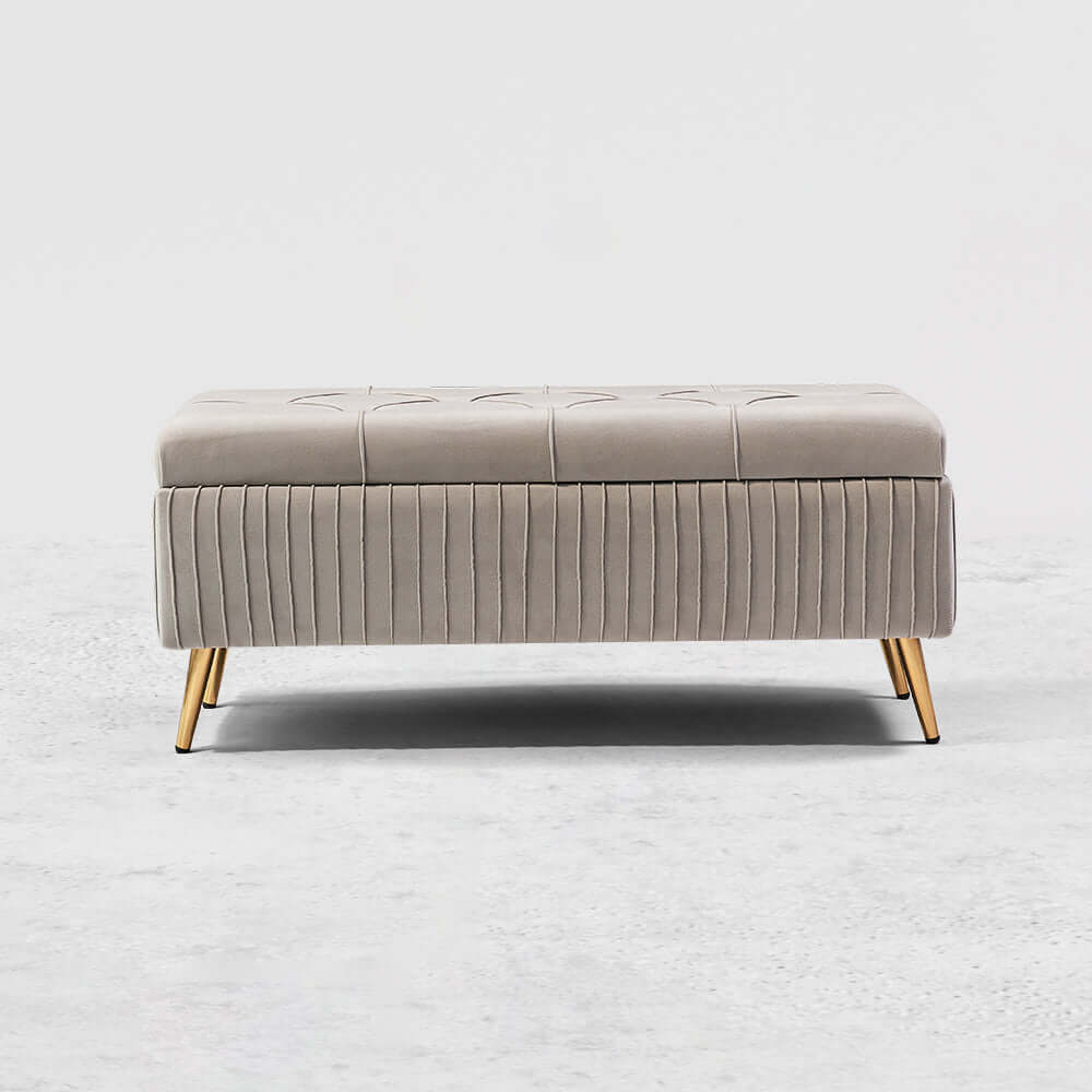 Modern gray velvet storage bench with gold legs for elegant decor