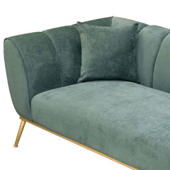 Elegant modern sofa with emerald green velvet upholstery and gold stainless steel base