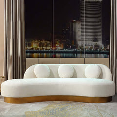 Elegant white and gold velvet sofa with stainless steel base and throw pillows for seating of 3