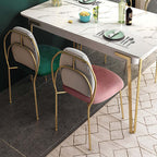Stylish armless dining chair with shiny gold metal legs, ideal side chair for modern dining room setting