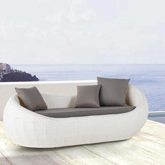 White Woven Rattan Round Outdoor Sofa with Cushion & Pillow and Curved Back as a Stylish Seating Option for Patio or Garden