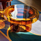 Cloud-shaped modern glass coffee table set with two pieces in vibrant orange, green, purple, and black