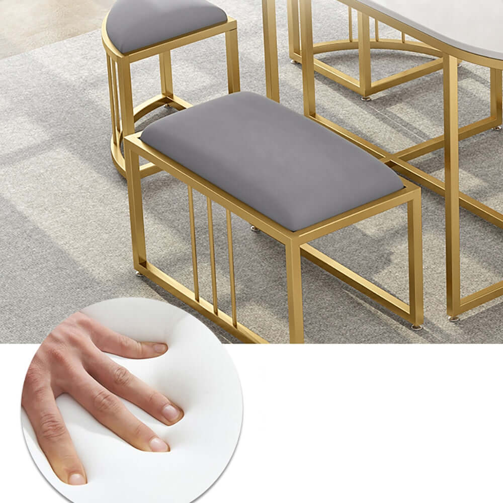 Chic oval dining table set with modern white stone top and metal frame for trendy dining space