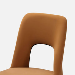 Modern orange dining chair with loop backrest armless design for comfortable seating