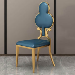 Elegant dining chair with golden legs and poker-style design, featuring durable PU leather for a luxurious touch