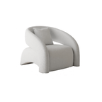 Modern curved hollow back sofa with orange, blue, yellow, and white boucle and velvet upholstery