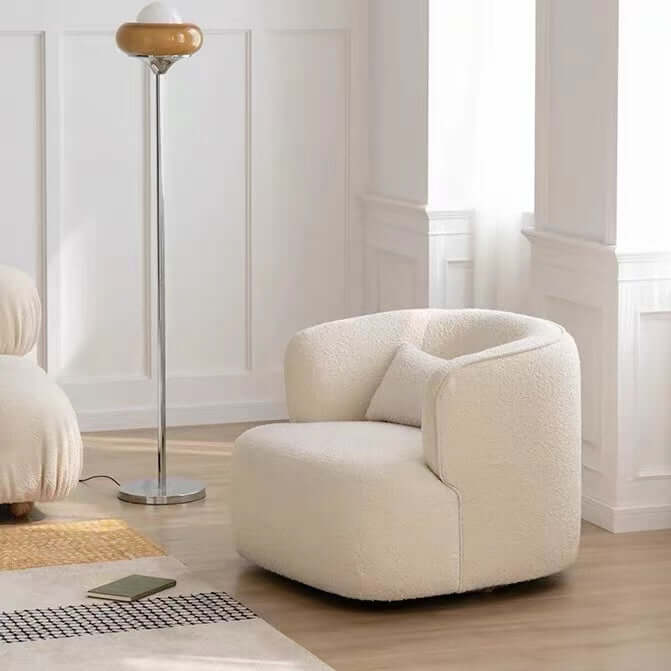 Nordic swivel accent chair in ivory boucle sherpa with white, gray, and blue tones
