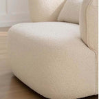 Nordic swivel accent chair in ivory boucle sherpa with white, gray, and blue tones