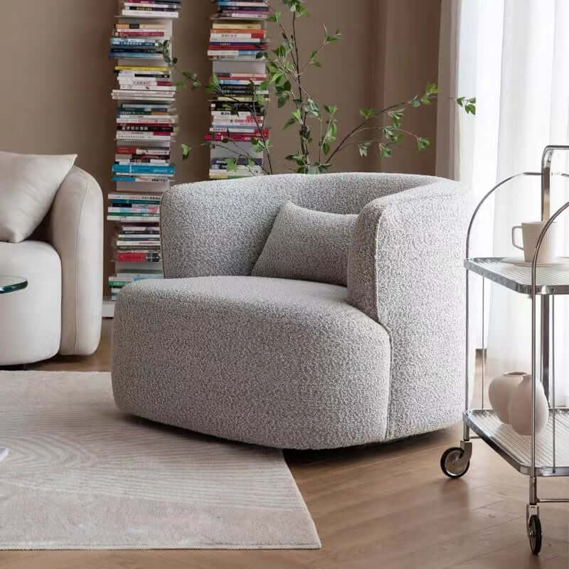 Nordic swivel accent chair in ivory boucle sherpa with white, gray, and blue tones