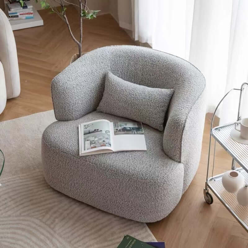 Nordic swivel accent chair in ivory boucle sherpa with white, gray, and blue tones