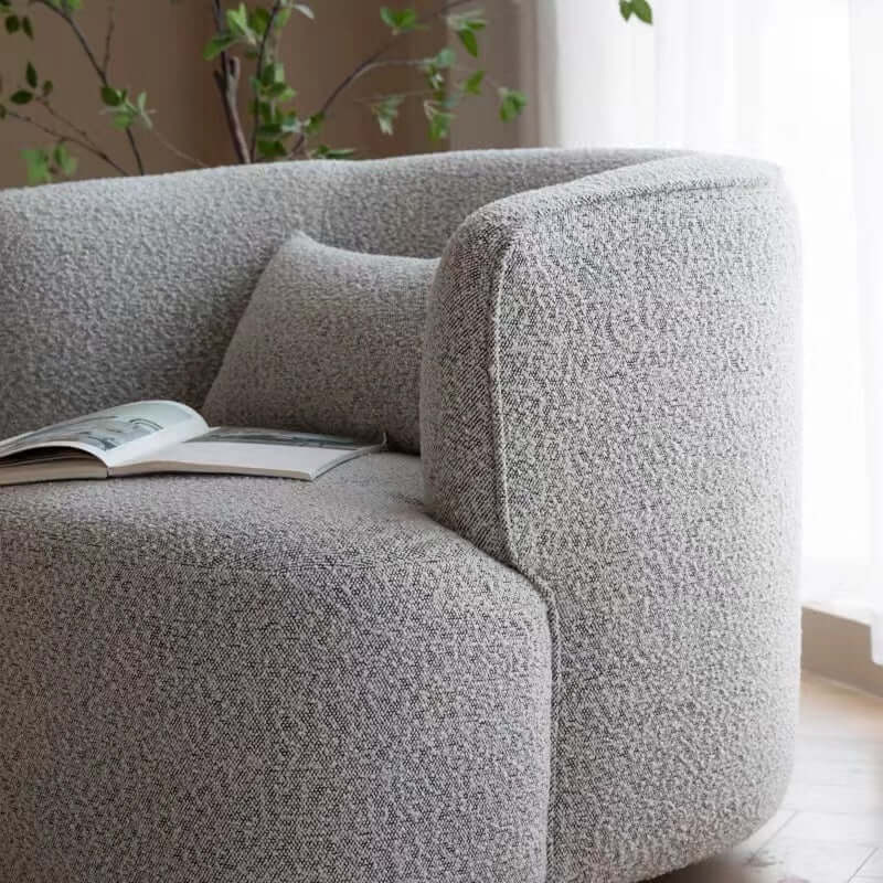 Nordic swivel accent chair in ivory boucle sherpa with white, gray, and blue tones