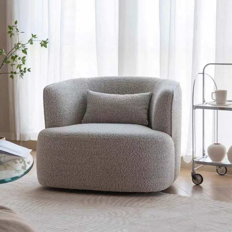 Nordic swivel accent chair in ivory boucle sherpa with white, gray, and blue tones