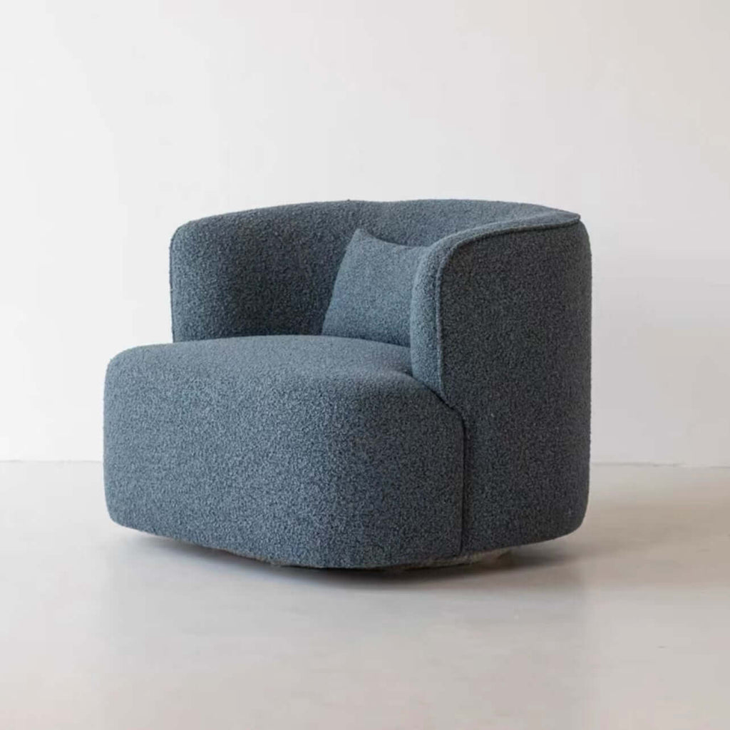 Nordic swivel accent chair in ivory boucle sherpa with white, gray, and blue tones