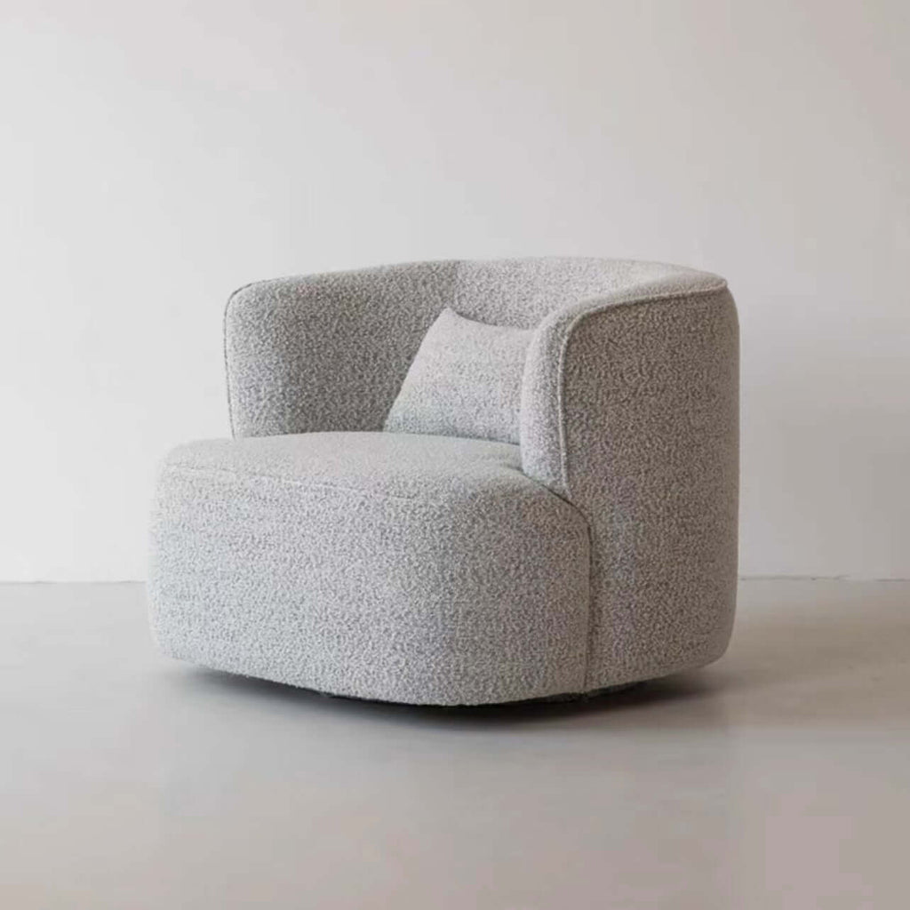 Nordic swivel accent chair in ivory boucle sherpa with white, gray, and blue tones