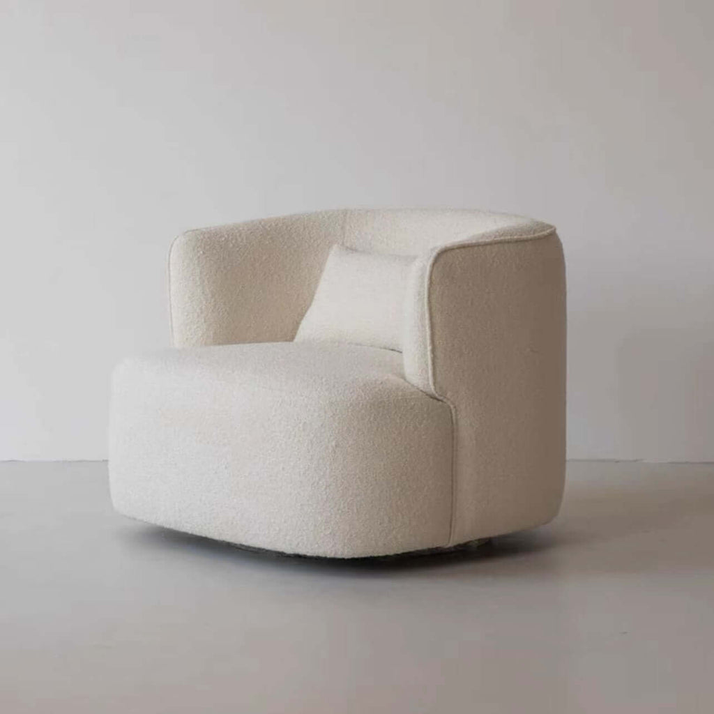 Nordic swivel accent chair in ivory boucle sherpa with white, gray, and blue tones