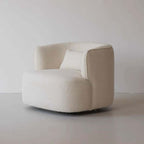 Nordic swivel accent chair in ivory boucle sherpa with white, gray, and blue tones