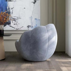 Contemporary blue accent chair for relaxing in a pumpkin moon pod