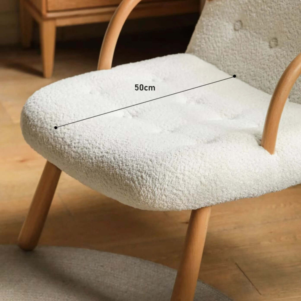 White and green lounge chair with boucle sherpa upholstery and solid wood armrests