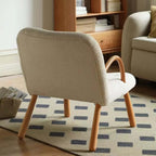 White and green lounge chair with boucle sherpa upholstery and solid wood armrests