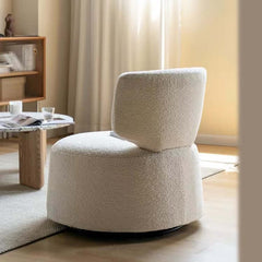 Cream armless accent chair with swivel base and boucle sherpa upholstery