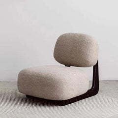 Chic light tan modern boucle sherpa lounge accent chair featuring wooden base and cozy textures