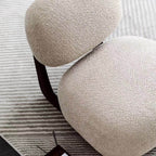 Light tan boucle sherpa lounge accent chair with wood base, modern and cozy design