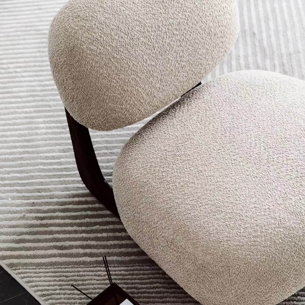 Light tan boucle sherpa lounge accent chair with wood base, modern and cozy design