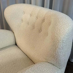 Modern ivory boucle sherpa accent chair featuring high back, fabric cover for luxurious and cozy ambiance