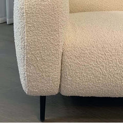 Chic modern ivory boucle sherpa accent chair with high back, fabric cover adding sophistication to any space