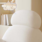 Nordic rocking lounge chair with white, gray, and pink boucle sherpa upholstery and solid wood base