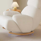 Nordic rocking lounge chair with white, gray, and pink boucle sherpa upholstery and solid wood base