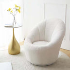 Yellow egg-shaped swivel boucle chair with sherpa upholstery, perfect as a lounge or vanity stool