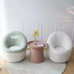 Yellow egg-shaped swivel boucle chair with sherpa upholstery, perfect as a lounge or vanity stool